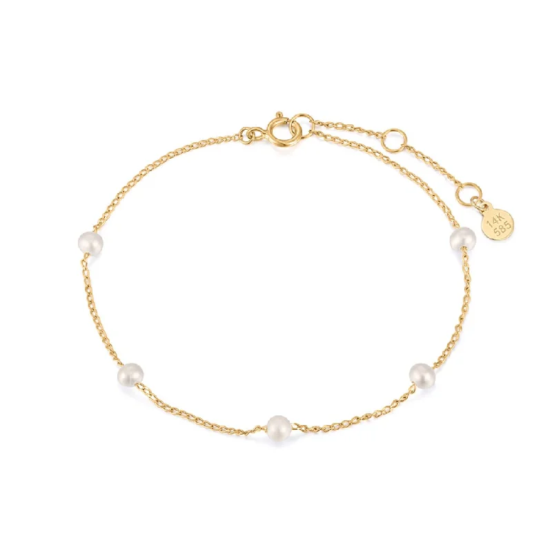 Thin bangles perfect for layering multiple styles -14K Yellow Gold Pearl Station Bracelet by Aurelie Gi